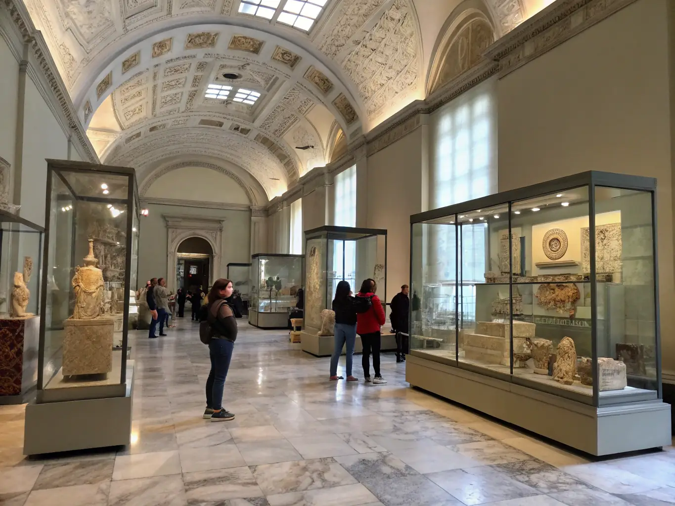 A photograph of visitors exploring a special exhibition at MUSEE PHOTO, showcasing historical photographs and contemporary works.